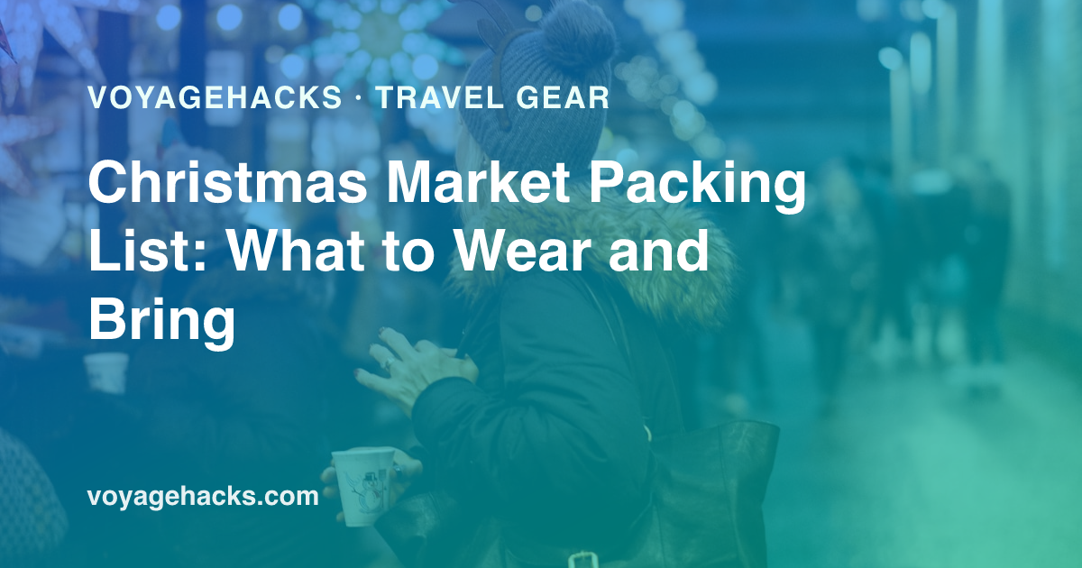 Christmas market packing list: merino base layer, packable down jacket, waterproof boots, gloves and hand warmers laid out for a European winter city break